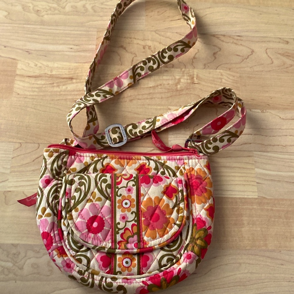 Vera Bradley pink and orange floral purse with magnetic pocket on the front